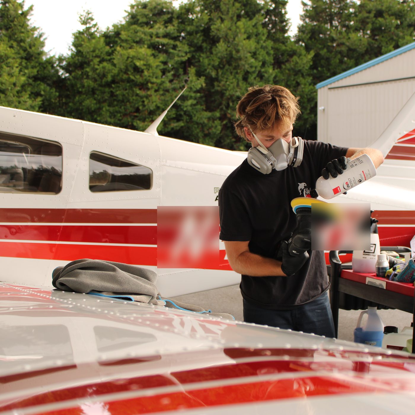 Machine polishing an aircraft fuselage, Olga Detailing Services